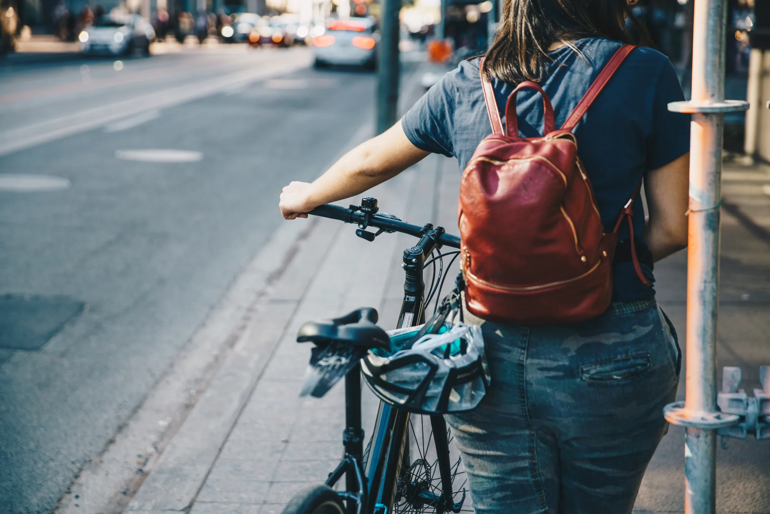 person-walking-bike-on-sidewalk_2700x